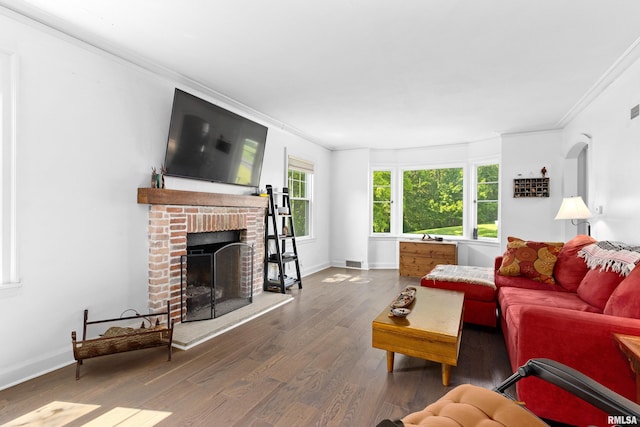 136 E Oak Park Dr, Peoria, IL 61614 - living room featuring crown molding, wood finished floors, and a brick fireplace