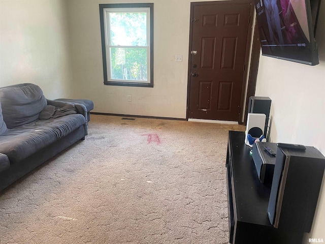 427 W Orchard St, Macomb, IL 61455 - carpeted living area featuring baseboards