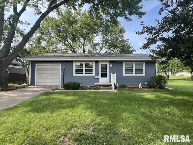 510 W Kelly St, Macomb, IL 61455 - view of front of home with concrete driveway, a garage, and a front yard