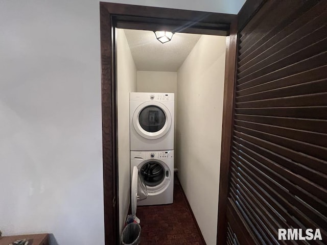 510 W Kelly St, Macomb, IL 61455 - washroom with stacked washing machine and dryer and brick patterned floors