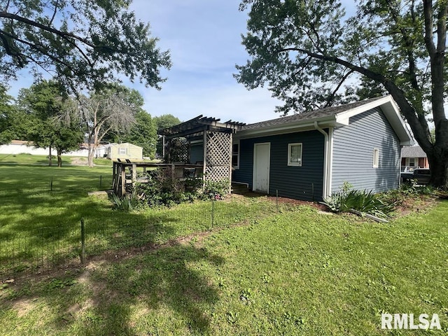 510 W Kelly St, Macomb, IL 61455 - back of house with a pergola and a yard