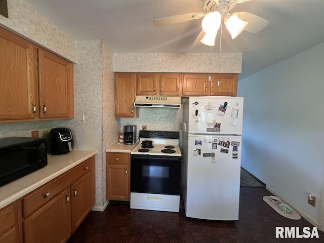 510 W Kelly St, Macomb, IL 61455 - kitchen featuring white appliances, under cabinet range hood, ceiling fan, and brown cabinetry