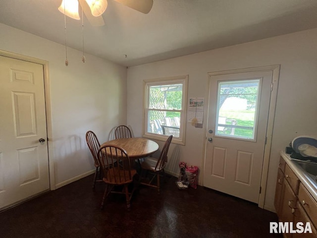 510 W Kelly St, Macomb, IL 61455 - dining room with baseboards and a ceiling fan