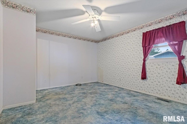 1810 Windsor St, Pekin, IL 61554 - empty room with wallpapered walls, a ceiling fan, and carpet floors
