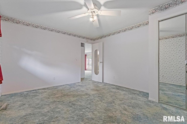 1810 Windsor St, Pekin, IL 61554 - carpeted empty room with ceiling fan and baseboards