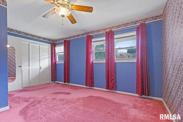 1810 Windsor St, Pekin, IL 61554 - unfurnished bedroom with carpet, a closet, and a ceiling fan