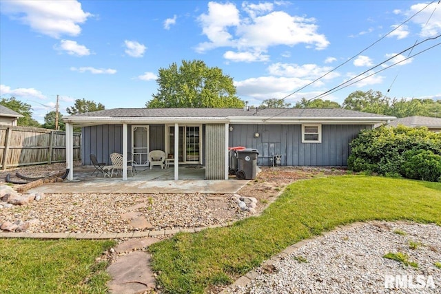 1810 Windsor St, Pekin, IL 61554 - rear view of property featuring board and batten siding and a patio