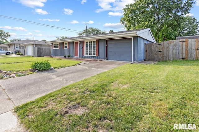 1810 Windsor St, Pekin, IL 61554 - ranch-style house with board and batten siding, an attached garage, and concrete driveway