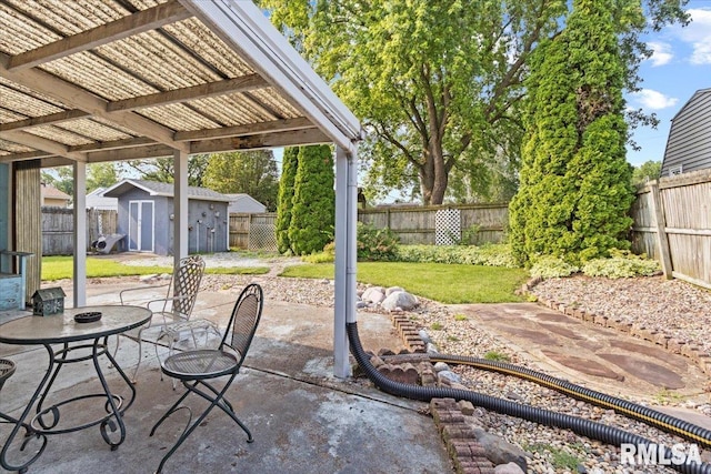 1810 Windsor St, Pekin, IL 61554 - fenced backyard featuring a storage unit and a patio area