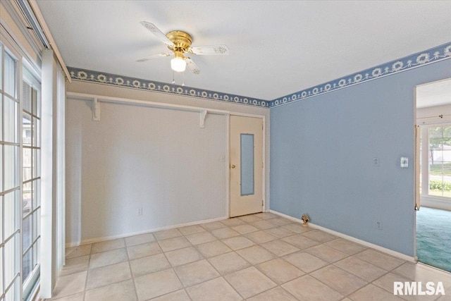 1810 Windsor St, Pekin, IL 61554 - tiled empty room with ceiling fan and baseboards