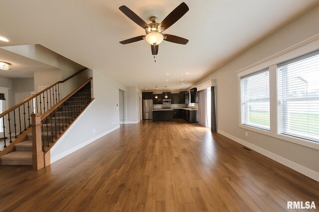 308 Pocono Ave, Morton, IL 61550 - unfurnished living room with stairway, dark wood-style flooring, ceiling fan, and recessed lighting