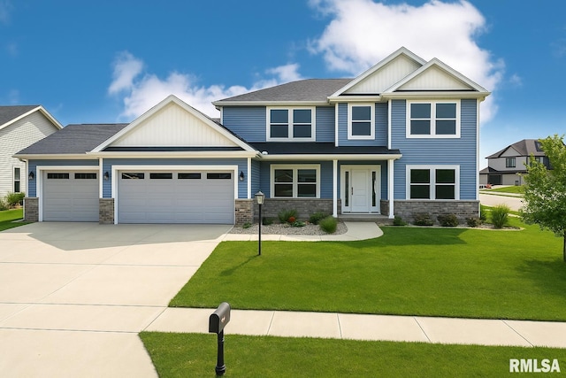 308 Pocono Ave, Morton, IL 61550 - craftsman-style home featuring a garage, concrete driveway, stone siding, a front lawn, and board and batten siding