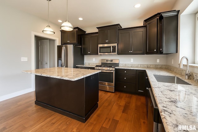 308 Pocono Ave, Morton, IL 61550 - kitchen featuring stainless steel appliances, recessed lighting, light stone counters, dark wood finished floors, and dark brown cabinets