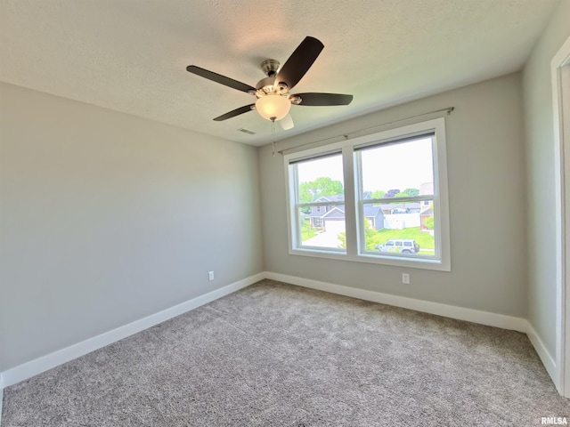 308 Pocono Ave, Morton, IL 61550 - carpeted empty room featuring a textured ceiling and a ceiling fan