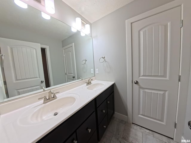 308 Pocono Ave, Morton, IL 61550 - full bath featuring double vanity, a textured ceiling, and marble finish floors