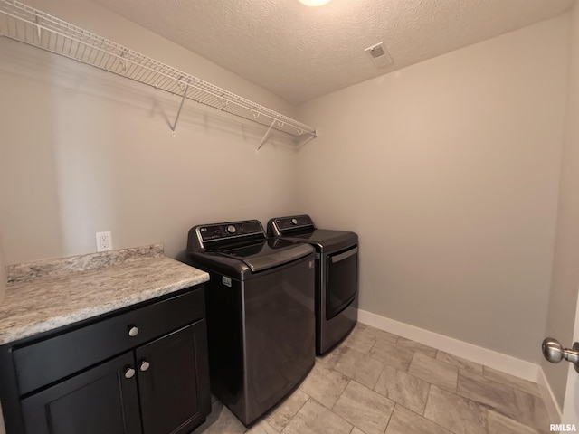 308 Pocono Ave, Morton, IL 61550 - laundry room with independent washer and dryer, cabinet space, and a textured ceiling
