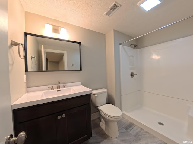 308 Pocono Ave, Morton, IL 61550 - bathroom with a textured ceiling, vanity, and a shower