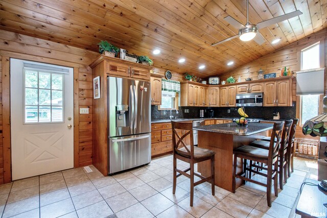 7019 Oak Run Dr, Dahinda, IL 61428 - kitchen featuring stainless steel appliances, lofted ceiling, decorative backsplash, wood ceiling, and a breakfast bar