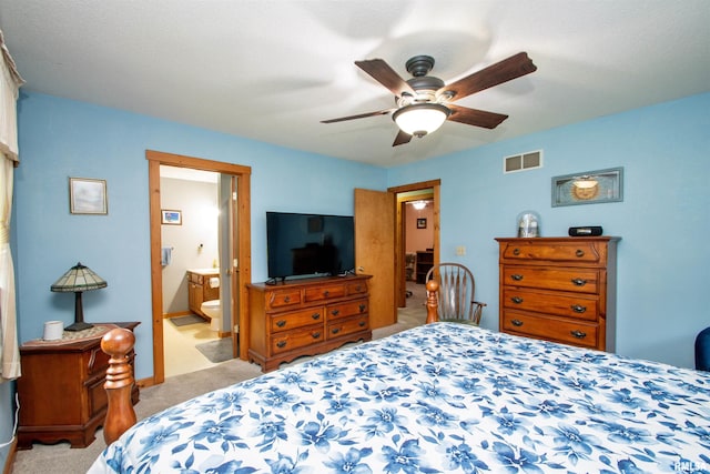 7019 Oak Run Dr, Dahinda, IL 61428 - bedroom with light carpet, a ceiling fan, and connected bathroom