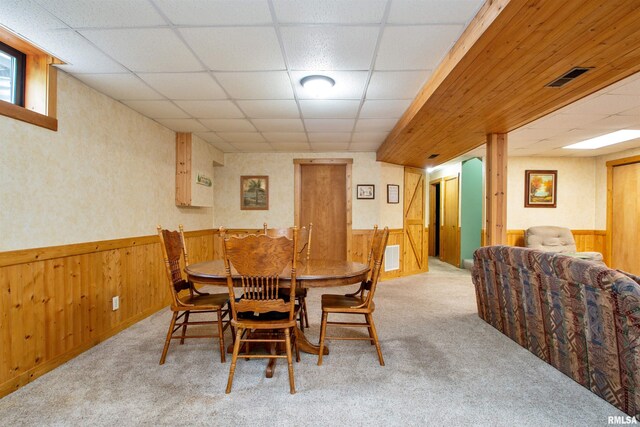 7019 Oak Run Dr, Dahinda, IL 61428 - dining space with carpet, wainscoting, wood walls, and a drop ceiling