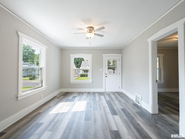 600 E Virginia Ave, Peoria, IL 61603 - foyer featuring crown molding, plenty of natural light, a ceiling fan, and wood finished floors