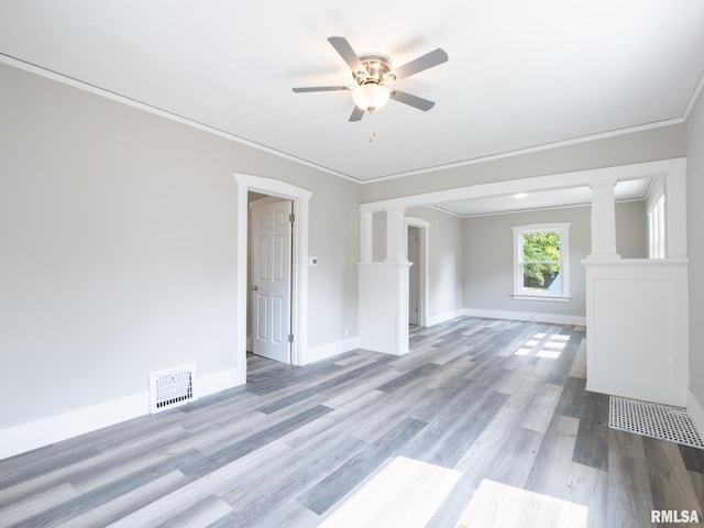600 E Virginia Ave, Peoria, IL 61603 - unfurnished room with ornate columns, ceiling fan, light wood-type flooring, and ornamental molding