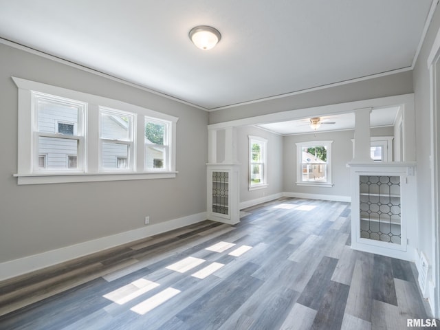 600 E Virginia Ave, Peoria, IL 61603 - unfurnished living room with plenty of natural light, ornamental molding, wood finished floors, and a ceiling fan