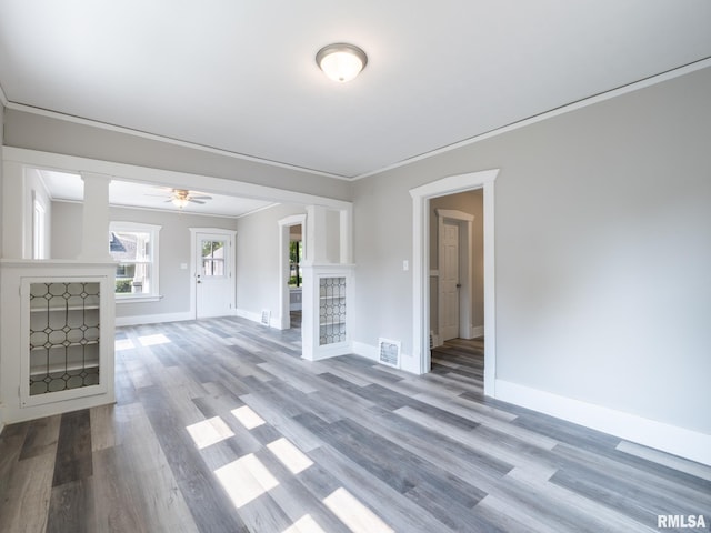 600 E Virginia Ave, Peoria, IL 61603 - unfurnished living room with wood finished floors, ornamental molding, decorative columns, and a ceiling fan