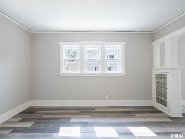 600 E Virginia Ave, Peoria, IL 61603 - spare room featuring crown molding and wood finished floors