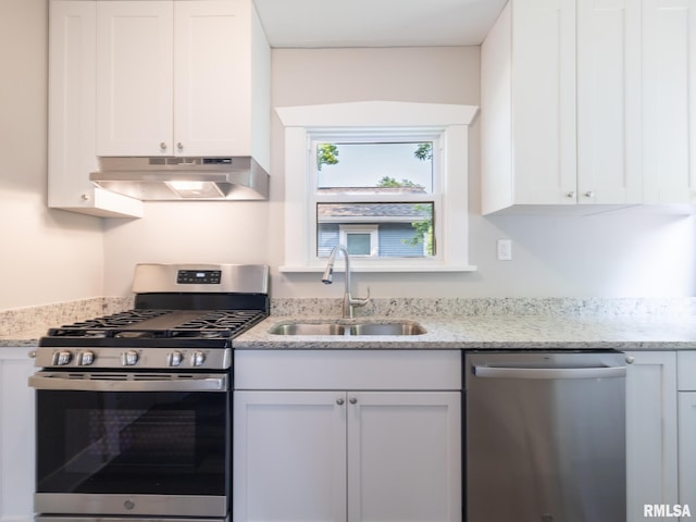 600 E Virginia Ave, Peoria, IL 61603 - kitchen featuring stainless steel appliances, under cabinet range hood, white cabinets, and light stone counters