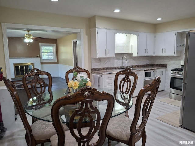 2604 W Kansas St, Peoria, IL 61604 - dining space featuring ceiling fan, a fireplace, and recessed lighting