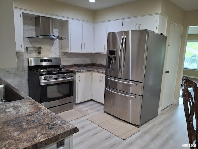 2604 W Kansas St, Peoria, IL 61604 - kitchen with stainless steel appliances, wall chimney exhaust hood, light wood finished floors, tasteful backsplash, and recessed lighting
