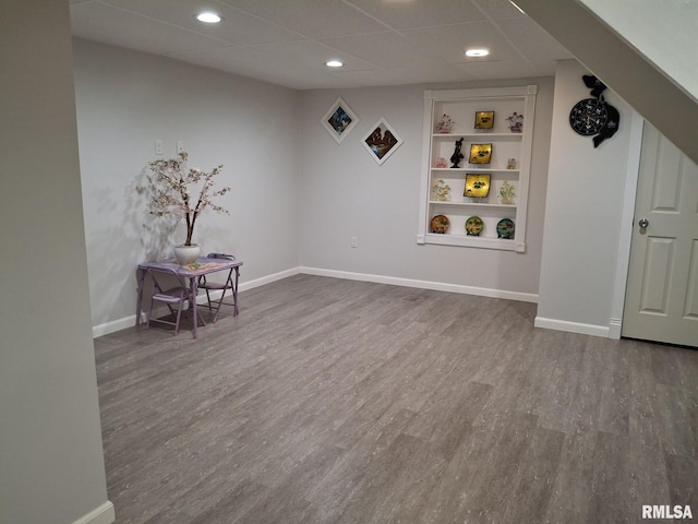 2604 W Kansas St, Peoria, IL 61604 - finished basement with built in features, wood finished floors, recessed lighting, and a drop ceiling