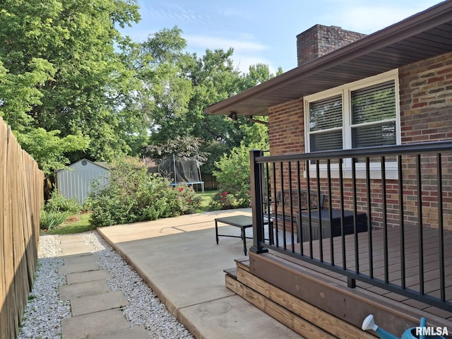 2604 W Kansas St, Peoria, IL 61604 - view of patio / terrace with a trampoline and a shed