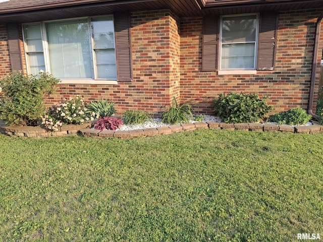 2604 W Kansas St, Peoria, IL 61604 - view of side of home with a lawn and brick siding