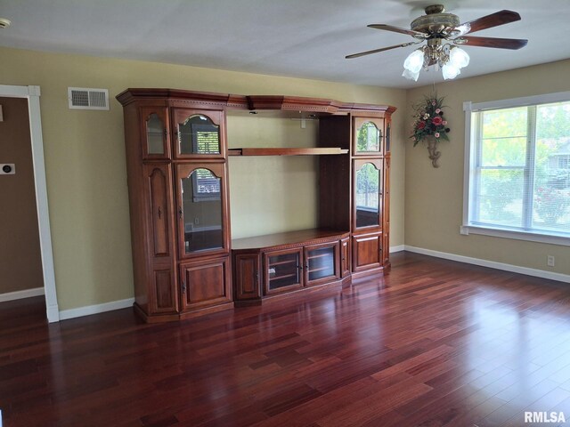 2604 W Kansas St, Peoria, IL 61604 - unfurnished living room featuring dark wood-type flooring and a ceiling fan