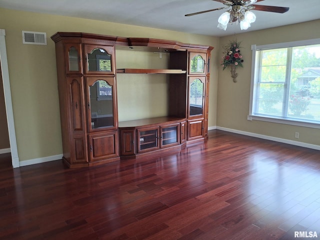 2604 W Kansas St, Peoria, IL 61604 - unfurnished living room featuring dark wood-type flooring and ceiling fan