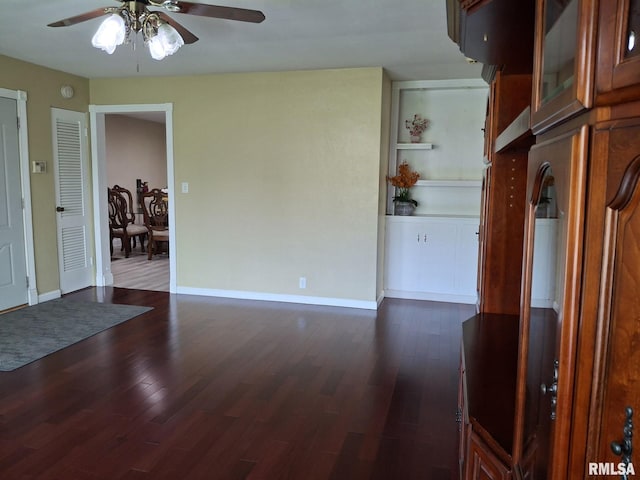 2604 W Kansas St, Peoria, IL 61604 - spare room with ceiling fan and dark wood-style flooring