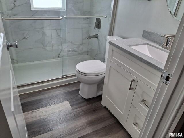 2604 W Kansas St, Peoria, IL 61604 - bathroom featuring vanity, wood finished floors, and a shower stall