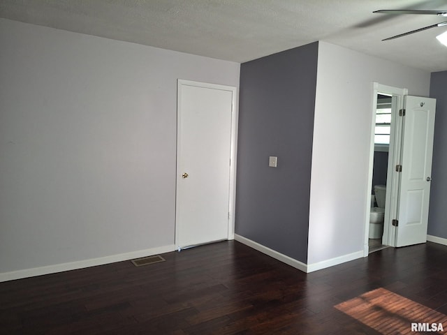 2604 W Kansas St, Peoria, IL 61604 - unfurnished room with dark wood-type flooring and ceiling fan