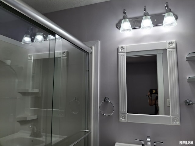 2604 W Kansas St, Peoria, IL 61604 - bathroom featuring a shower with door and a sink