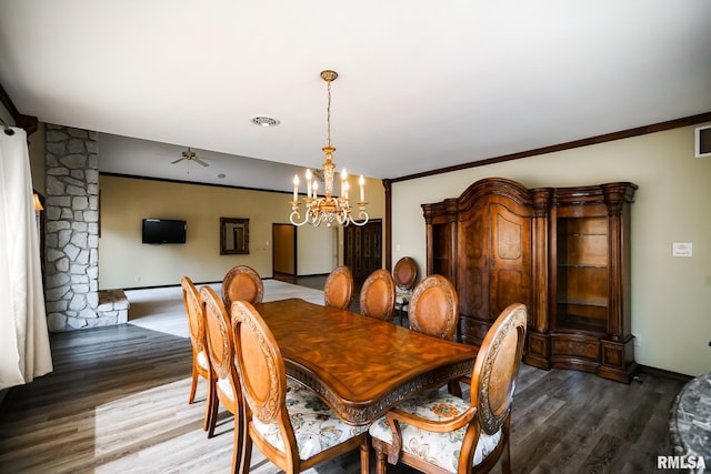 241 Birch Pl, Kewanee, IL 61443 - dining space with dark wood-style floors, a chandelier, and crown molding