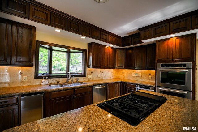 241 Birch Pl, Kewanee, IL 61443 - kitchen featuring stainless steel appliances, stone counters, dark brown cabinets, and recessed lighting