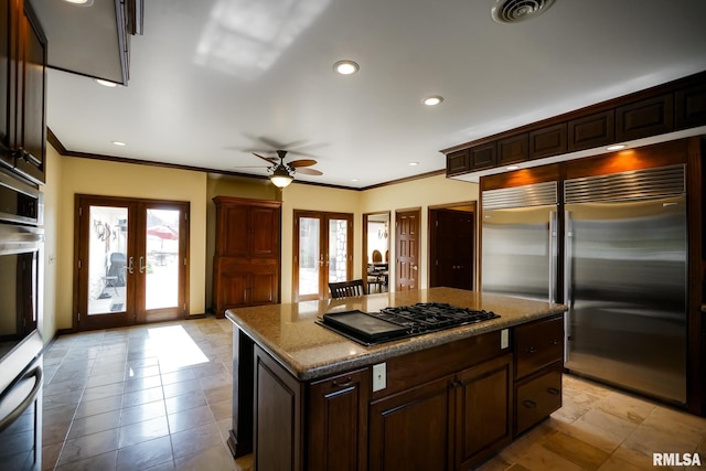 241 Birch Pl, Kewanee, IL 61443 - kitchen with appliances with stainless steel finishes, french doors, plenty of natural light, ornamental molding, and a ceiling fan
