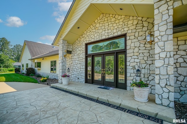 241 Birch Pl, Kewanee, IL 61443 - doorway to property featuring stone siding, french doors, and a patio area