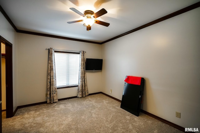 241 Birch Pl, Kewanee, IL 61443 - spare room featuring light colored carpet, a ceiling fan, and crown molding