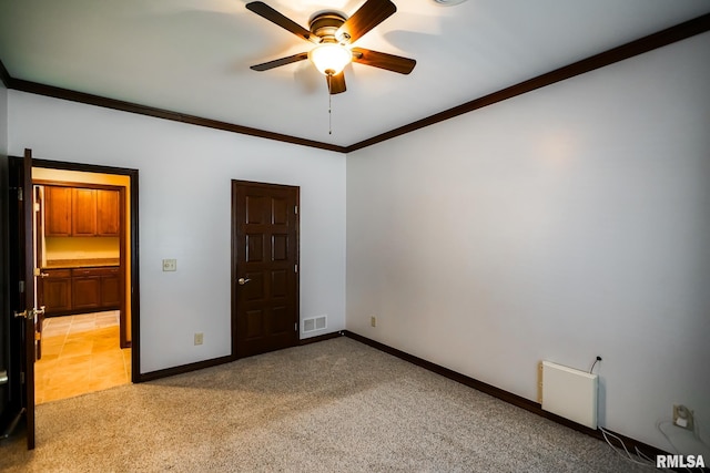 241 Birch Pl, Kewanee, IL 61443 - unfurnished bedroom featuring light colored carpet, ornamental molding, and ceiling fan