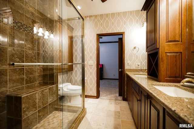 241 Birch Pl, Kewanee, IL 61443 - full bathroom with a tile shower, double vanity, and wallpapered walls