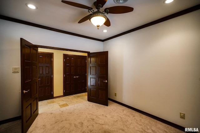 241 Birch Pl, Kewanee, IL 61443 - unfurnished bedroom with recessed lighting, crown molding, light colored carpet, multiple closets, and a ceiling fan