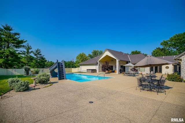 241 Birch Pl, Kewanee, IL 61443 - view of swimming pool featuring a water slide, a patio area, and stairway